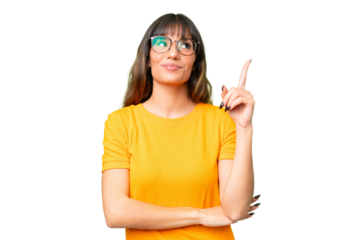 Young caucasian woman over isolated chroma key background pointing up a great idea