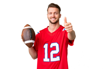 Young caucasian man playing rugby over isolated chroma key background with thumbs up because something good has happened