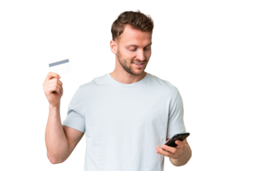Young handsome caucasian man over isolated chroma key background buying with the mobile with a credit card