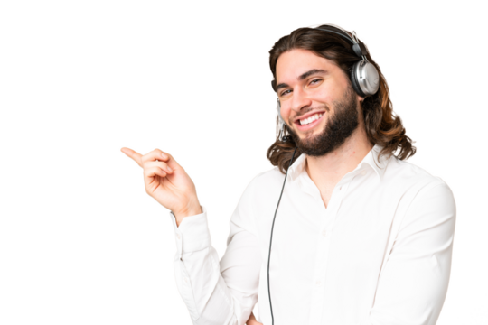 Telemarketer man working with a headset over isolated chroma key background pointing finger to the side