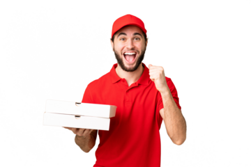 pizza delivery man with work uniform picking up pizza boxes over isolated chroma key background celebrating a victory in winner position