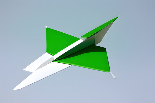 Handmade light green paper plane isolated on white