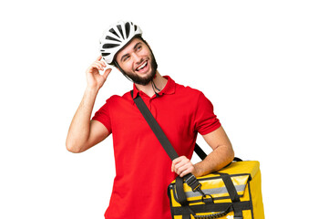 Young delivery man with thermal backpack over isolated chroma key background thinking an idea