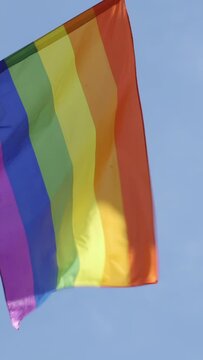 Gay pride rainbow flag blowing in the wind, copyspace available