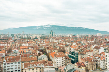 Sofia cityscape main streets and old city district with Vitosha mountain view. Travel to Bulgaria concept aerial view panorama
