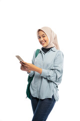 smiling Asian Muslim female student holding mobile phone on white background