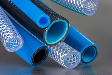 Bunch of flexible water and air hose pipe - obrazy, fototapety, plakaty