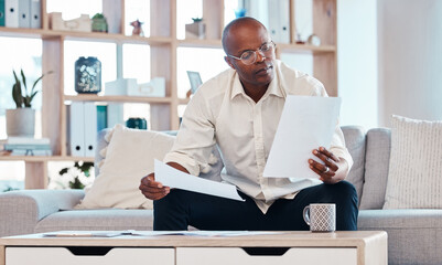 Man reading paperwork in living room home for planning, budget report and investment contract....