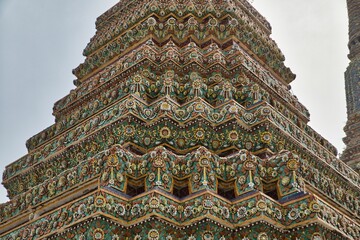 Beautifully detailed towers with many ornaments at Wat Pho temple in Bangok in Thailand.