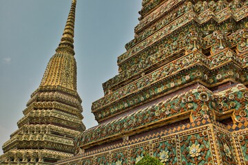 Beautifully detailed towers with many ornaments at Wat Pho temple in Bangok in Thailand.