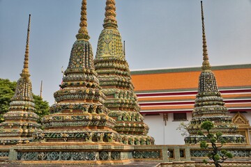 Beautifully detailed towers with many ornaments at Wat Pho temple in Bangok in Thailand.