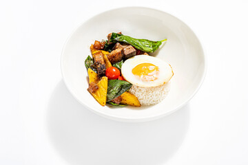 rice with fried egg and vegetables