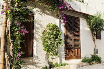 Fototapeta na wymiar Picturesque Mediterranean street view, Italy, Beautiful facade in italian old town