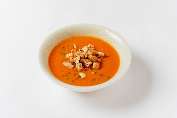 tomato soup with croutons on the white