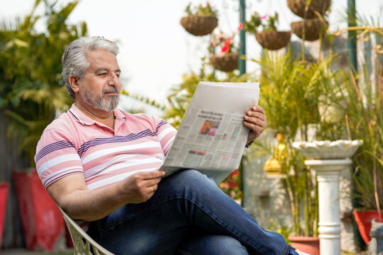 Old man reading news paper. lifestyle concept.