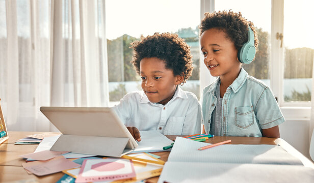 Tablet, Headphones And Children Doing A Elearning Class Together In The Dining Room At Home. Technology, Online School And Boy Kids Or Brothers Watching Virtual Lesson On Mobile Device In Their House