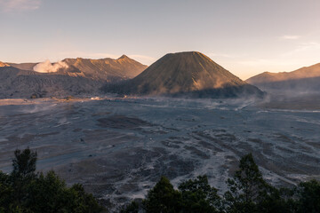 Amazing desert volcanic landscape of Bromo Volcano and Batok Volcano during sunset, Java, Indonesia