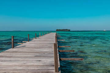 Fototapeta premium Amazing turquoise lagoon with jetty on Karimunjava tropical island, Indonesia