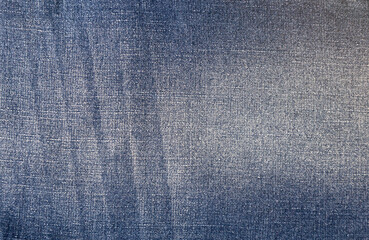 Texture of blue jeans close-up. Denim background.