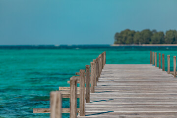 Amazing turquoise lagoon with jetty on Karimunjava tropical island, Indonesia