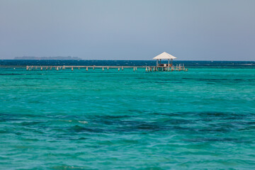 Amazing turquoise lagoon with jetty on Karimunjava tropical island, Indonesia