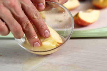 Toss quarters of apples in lemon juice. Making Apple Tarte Tatin with Cinnamon Series.