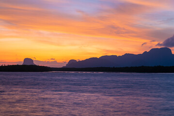 red sky sunset and river or lake
