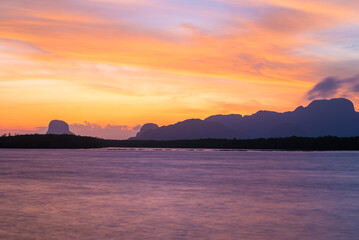 red sky sunset and river or lake