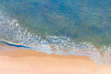 (Top view) Aerial view drone over beach sea. Beautiful sea waves. Beach sand and amazing sea. Summer sunset seascape. Phuket Thailand Beach. Water texture. Top view of the fantastic natural sunsets