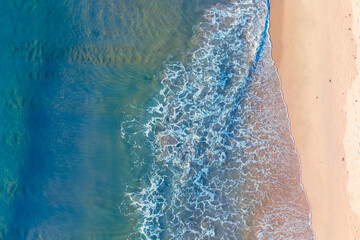 (Top view) Aerial view drone over beach sea. Beautiful sea waves. Beach sand and amazing sea. Summer sunset seascape. Phuket Thailand Beach. Water texture. Top view of the fantastic natural sunsets
