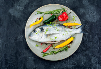 Fresh dorado fish on a plate, flat lay