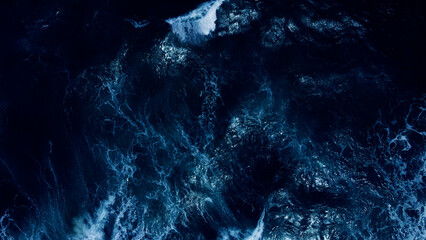 Top view dark blue sea water wave Big wave in black sea Top-down form aerial view Drone high...