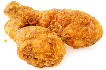 Two crispy fried chicken drumsticks isolated on white.