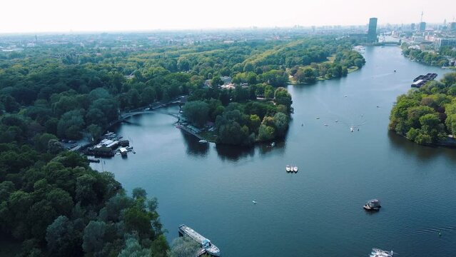 Aerial drone view of boats in the Spree River near Insel der Jugend and Treptower Park Berlin
