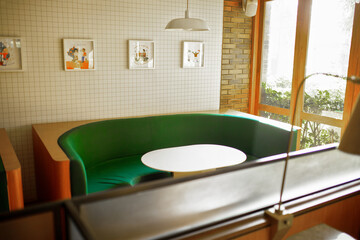 Modern Cafe Interior with a wooden list and a little wall. With a semicircle chair and a white table. It's Modern Minimalism concept