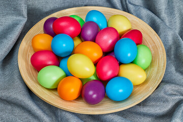 Lots of colored eggs on a gray background. Happy Easter