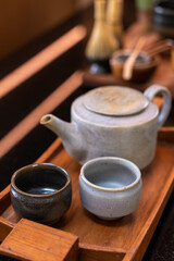 japanese green tea cup traditional, Green tea accessories on tray on wooden table. Japanese tea ceremony concept.