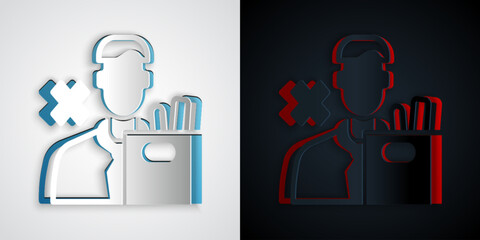 Paper cut Dismissed sad young man carrying box with his personal belonging leaving his job icon isolated on grey and black background. Employee fired from work. Paper art style. Vector