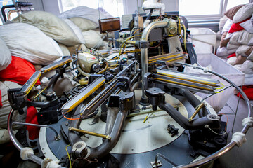 production of capron tights. Textile factory with machines and equipment for production of women's stockings and capron tights.