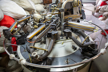 production of capron tights. Textile factory with machines and equipment for production of women's stockings and capron tights.