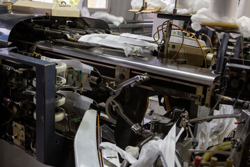 production of capron tights. Textile factory with machines and equipment for production of women's stockings and capron tights.