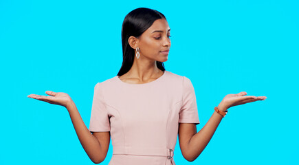 Choice, option or decision and a woman on a blue background in studio with a hand gesture....