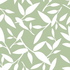 Floral seamless pattern with leaves. White leaves silhouettes on a green background. Vector green and white seamless background 