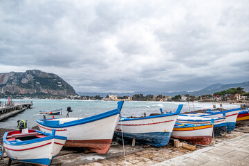 Fototapeta na wymiar FISHERMENS BOATS AT THE HARBOR IN PALERMO, SICILY