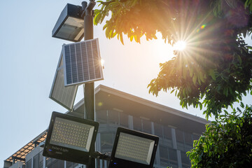Solar Light. Public city light with solar panel powered on blue sky with clouds. Park public...