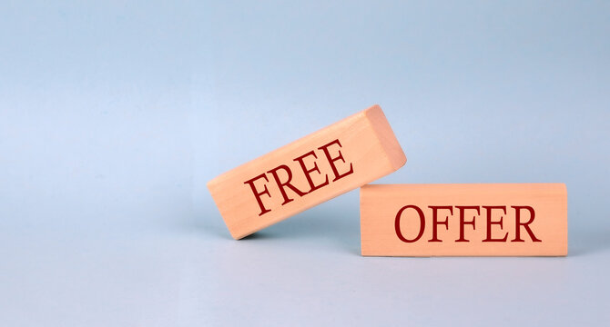FREE OFFER text on the wooden block, blue background