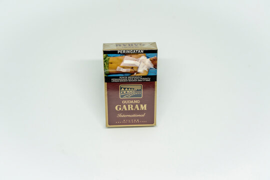 Jakarta, Indonesia. March 27, 2023: Gudang Garam filter close up. Packaged cigarettes. Cigarette Gudang Garam filter on isolated background