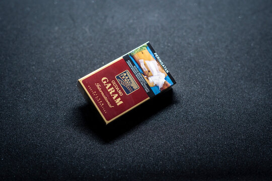 Jakarta, Indonesia. March 27, 2023: Gudang Garam filter close up. Packaged cigarettes. Cigarette Gudang Garam filter on isolated background