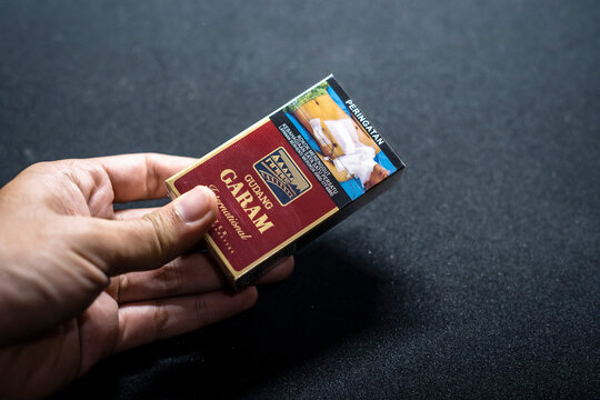 Jakarta, Indonesia. March 27, 2023: Gudang Garam filter close up. Packaged cigarettes. Cigarette Gudang Garam filter on isolated background