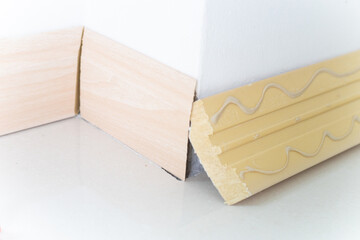 Floor Cornice UPVC installation in new cozy house interior building